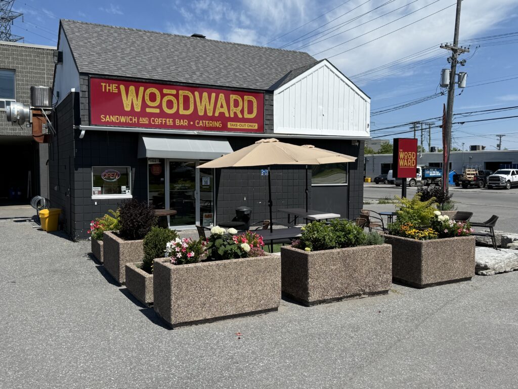 Exterior of The Woodward café and catering location on Woodward Drive in Ottawa with outdoor seating